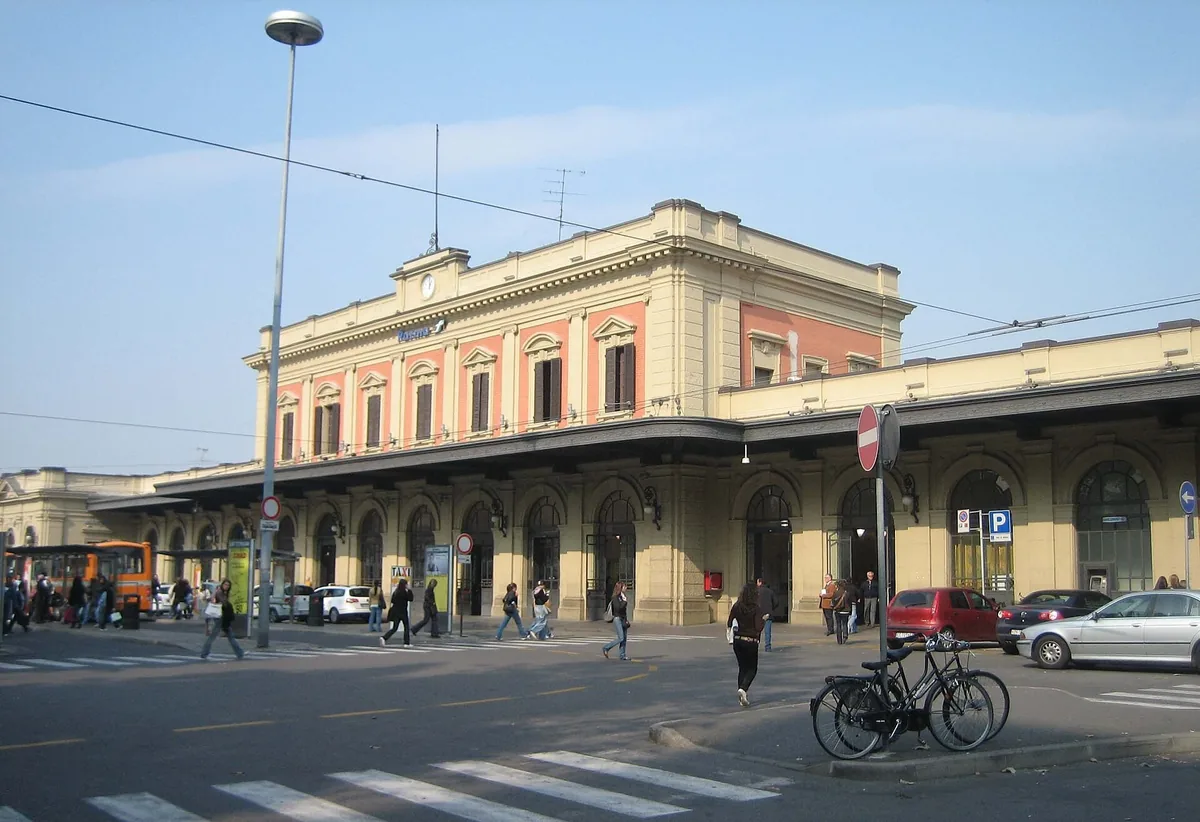 Parma railway station's 19th-century building seen from the street