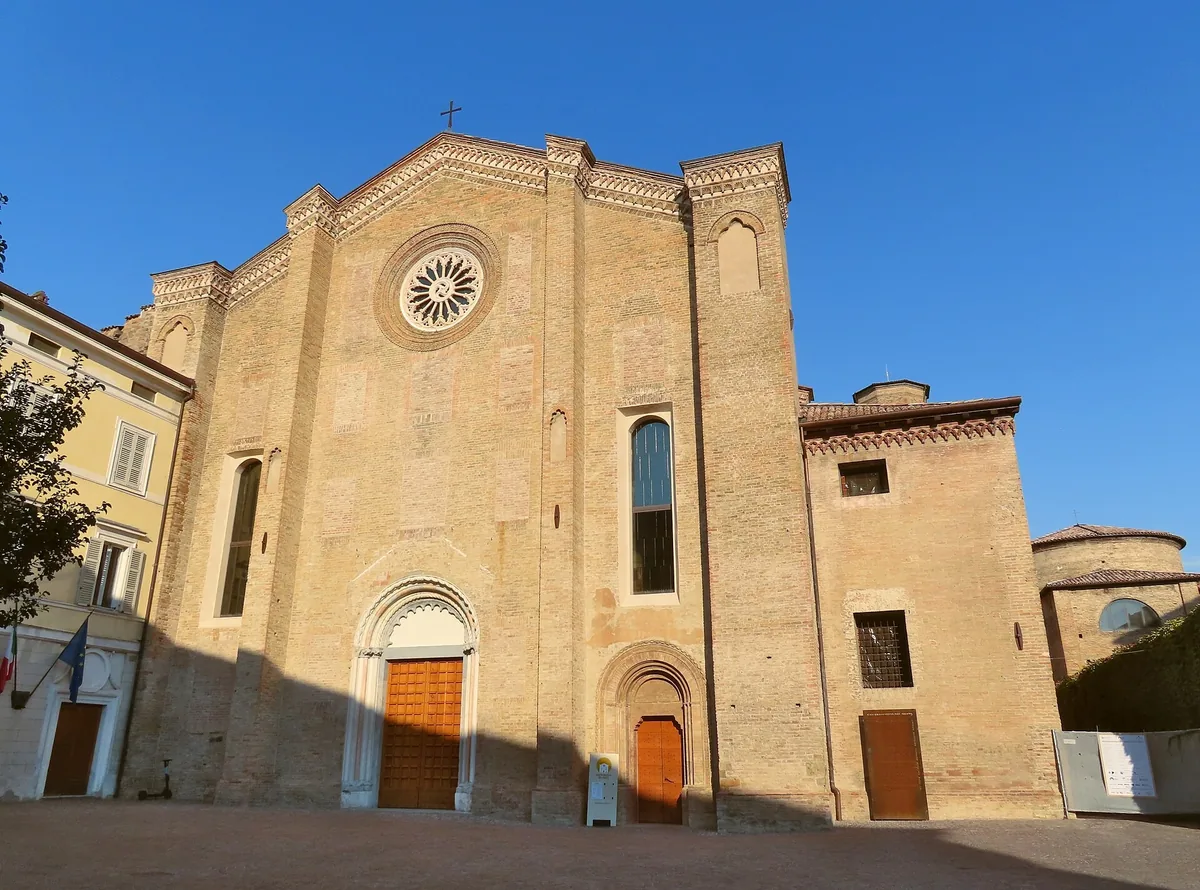 Gothic brick facade and rose window of San Francesco del Prato in Parma