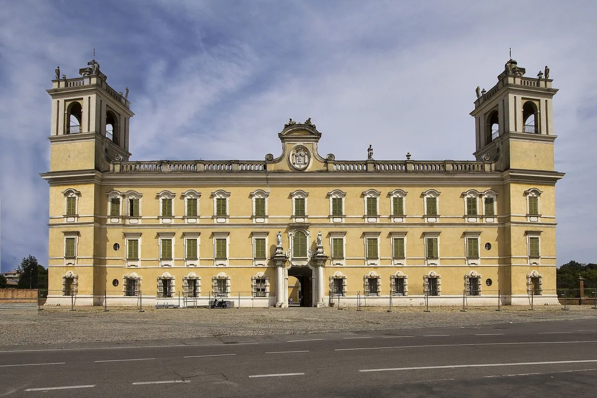 Yellow facade and twin towers of the Reggia di Colorno ducal palace