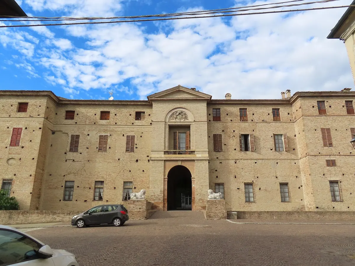 Brick facade and classical portal of the Rocca Meli Lupi in Soragna